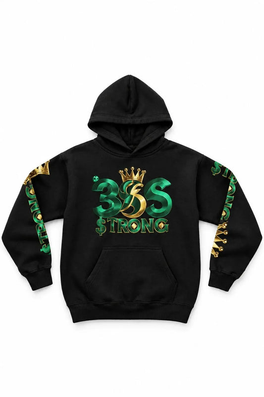 A black pullover hoodie featuring a large graphic on the front with the text '365 $TRONG' in green and gold, topped with a gold crown. The sleeves also feature green and gold graphic details.