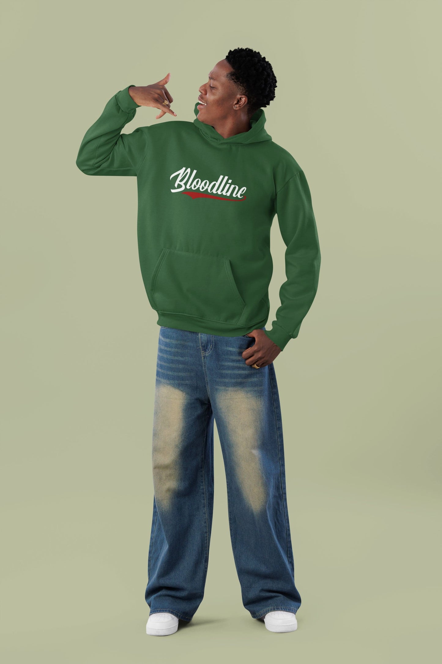 Person wearing a green hoodie with 'Bloodline' text on a light green background