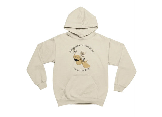 Beige hoodie with a graphic of a dog and motivational quote on a white background