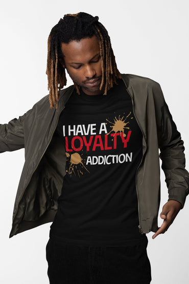 Person wearing a black t-shirt with 'I Have a Loyalty Addiction' text and graphic design.