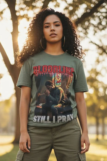 Person wearing a graphic t-shirt with text and images outdoors