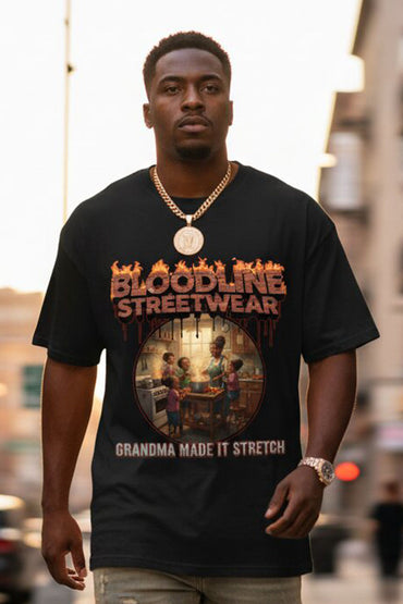 Man wearing a black 'Bloodline Streetwear' t-shirt with graphic design in an urban setting