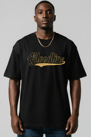 Man wearing a black t-shirt with 'Bloodline' printed in gold on a plain background