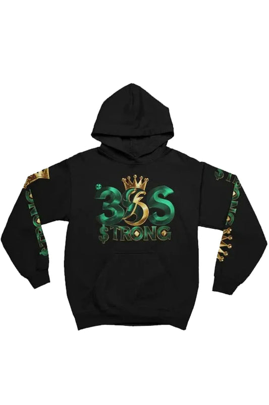 A black pullover hoodie featuring a large graphic on the front with the text '365 $TRONG' in green and gold, topped with a gold crown. The sleeves also feature green and gold graphic details.