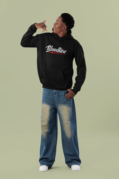 Person wearing a black hoodie with 'Bloodline' text and blue jeans on a light green background