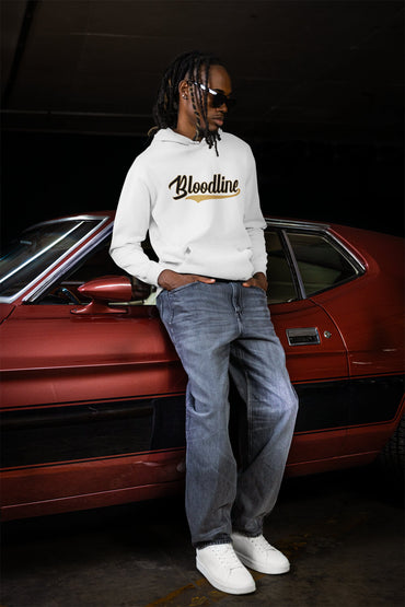 Person wearing a hoodie with 'Bloodline' text leaning against a red car.