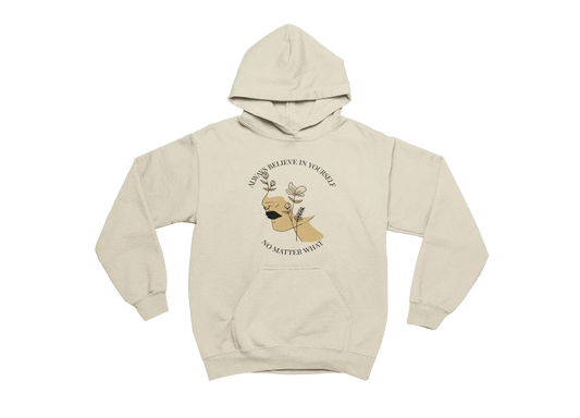 Beige hoodie with a graphic of a dog and motivational quote on a white background