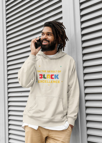 Man wearing a hoodie with 'Black Excellence' text, standing against a textured wall.