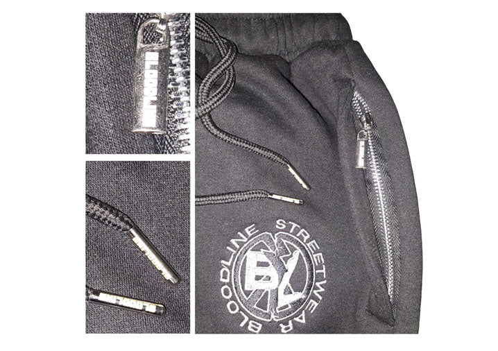 Gray pants with zippers and a brand logo on a white background