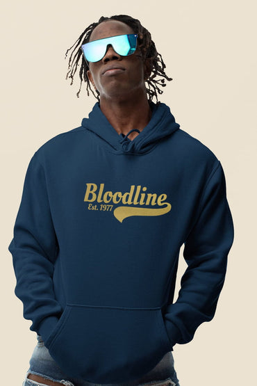 Person wearing a navy hoodie with 'Bloodline' logo on a beige background