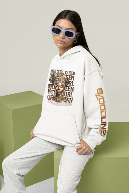 Person wearing a white hoodie with graphic design and text, sitting on a green surface.