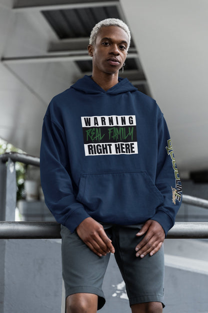 Person wearing a navy blue hoodie with text in an urban setting