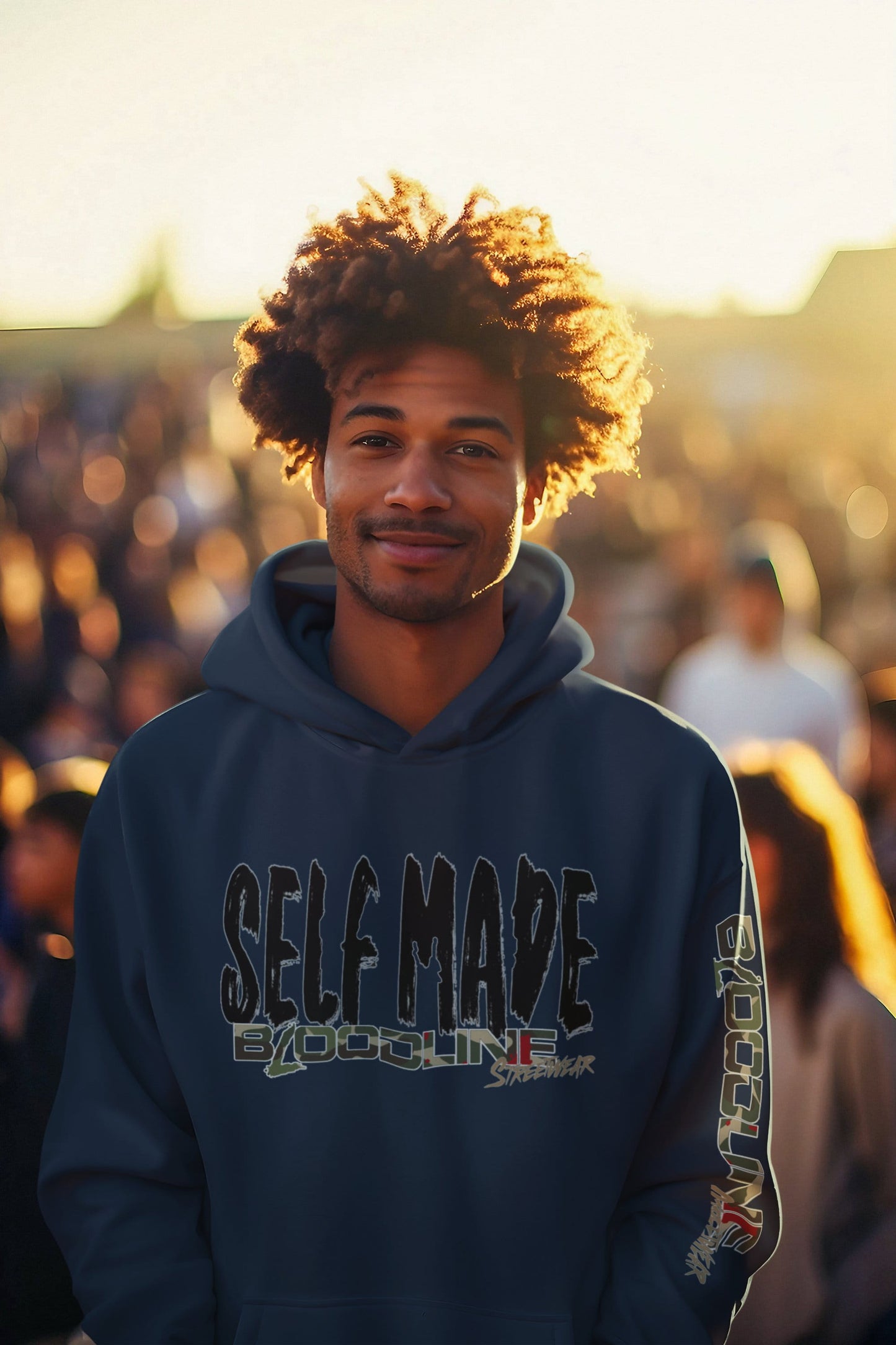 Man wearing a hoodie with 'SELF MADE' text in a crowd