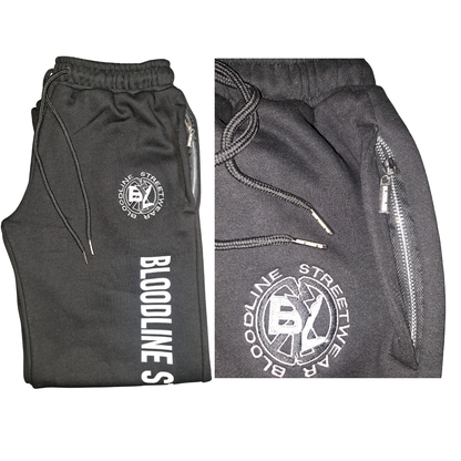 black sweatpants with branding on a white background