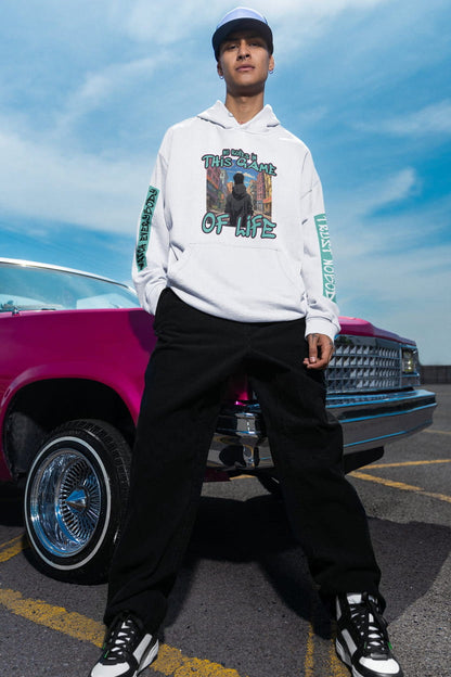 Person wearing a white hoodie with graphic design in front of a classic car.