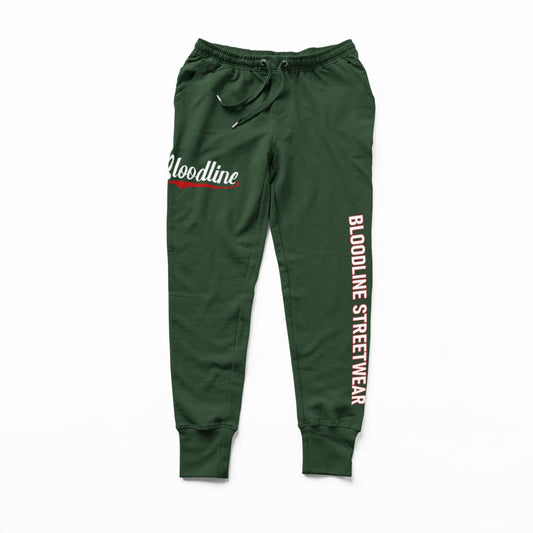 Forest green sweatpants with 'Bloodline Street Wear' branding on a white background