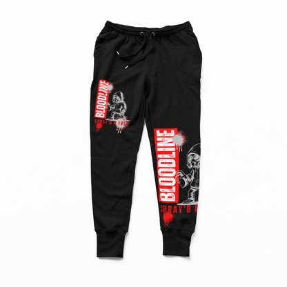Black jogger pants with red and white graphic designs on a white background