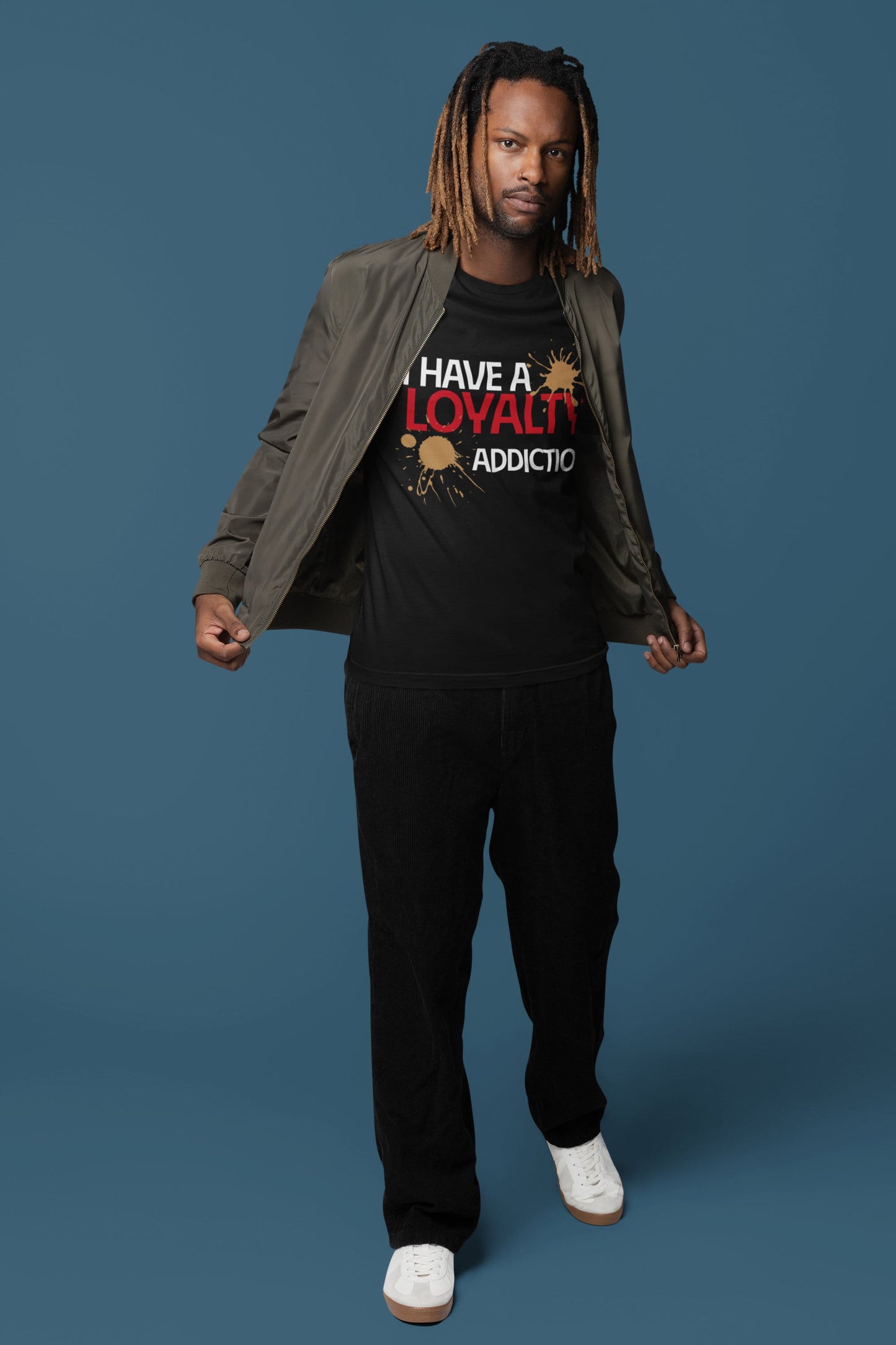 Person wearing a black t-shirt with text and graphics on a blue background