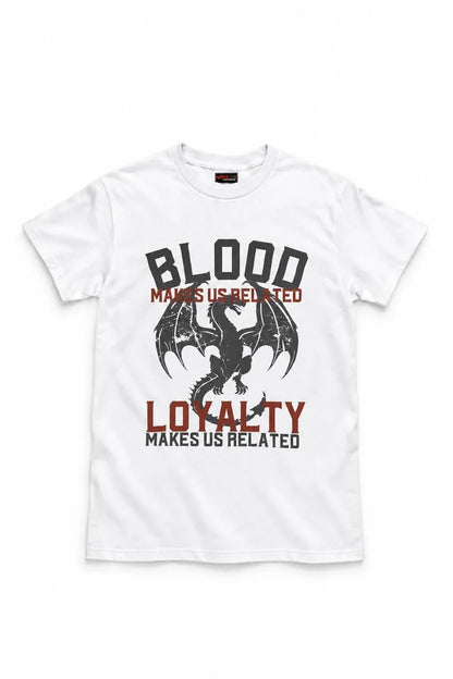 A white short-sleeve crewneck t-shirt featuring a graphic print of a black dragon with the text 'BLOOD MAKES US RELATED' and 'LOYALTY MAKES US RELATED' in black and red lettering.