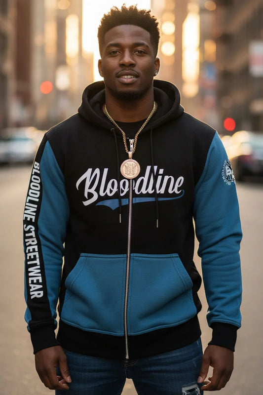 Person wearing a black and blue 'Bloodline' hoodie with a cityscape background