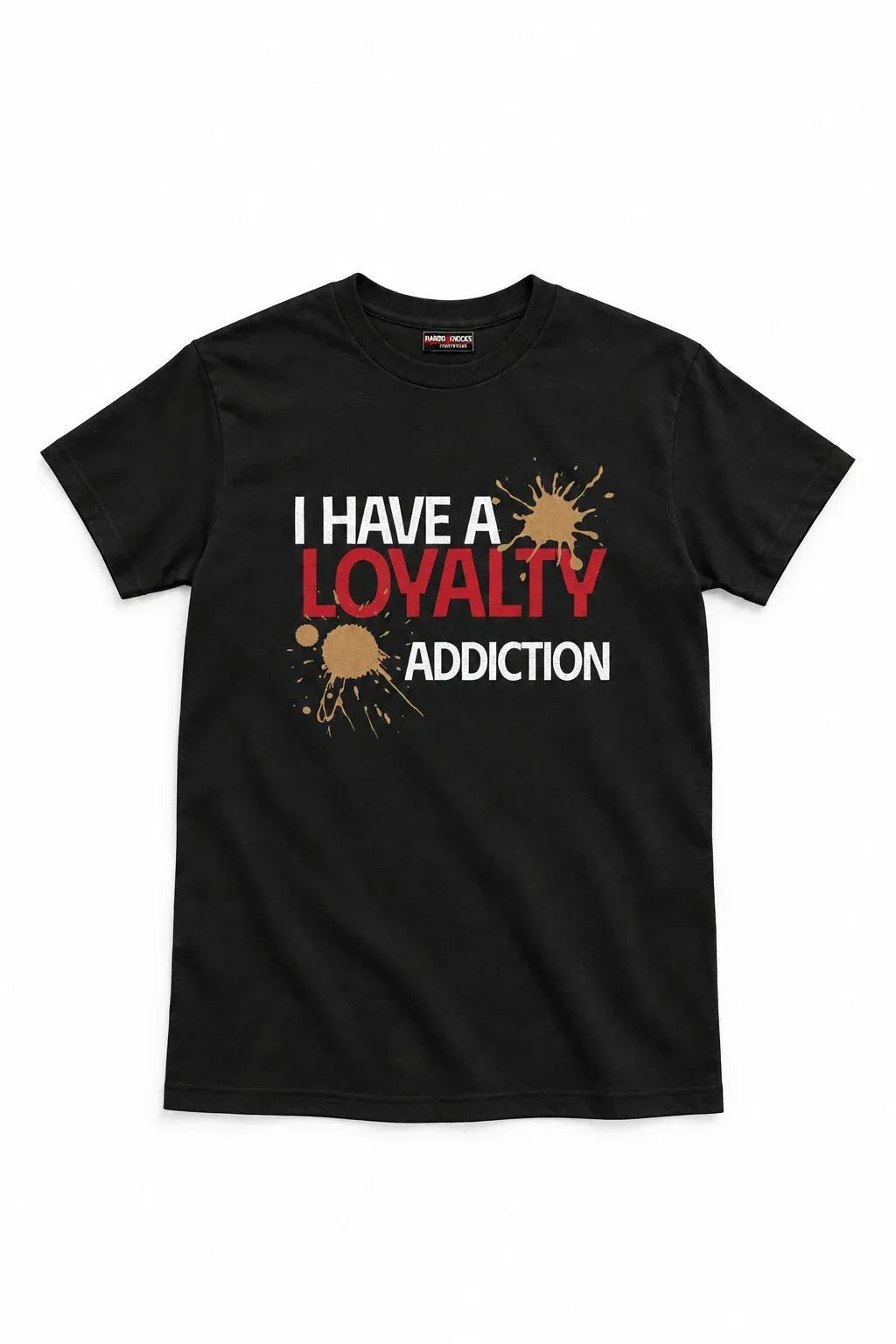A black short-sleeve crewneck t-shirt with a graphic print on the front reading 'I HAVE A LOYALTY ADDICTION' in white and red text, accented with brown paint splatters, shown against a plain white background.