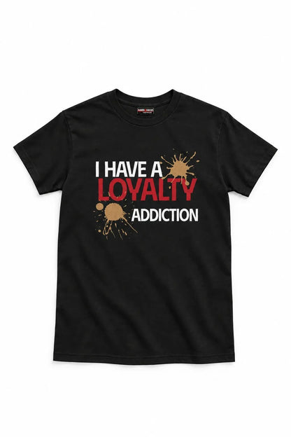 A black short-sleeve crewneck t-shirt with a graphic print on the front reading 'I HAVE A LOYALTY ADDICTION' in white and red text, accented with brown paint splatters, shown against a plain white background.