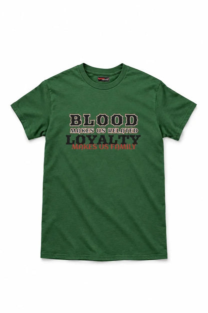 A green short-sleeve crewneck t-shirt with a graphic text print on the chest reading 'BLOOD makes us related LOYALTY makes us family' in black and red lettering, displayed flat against a white background.