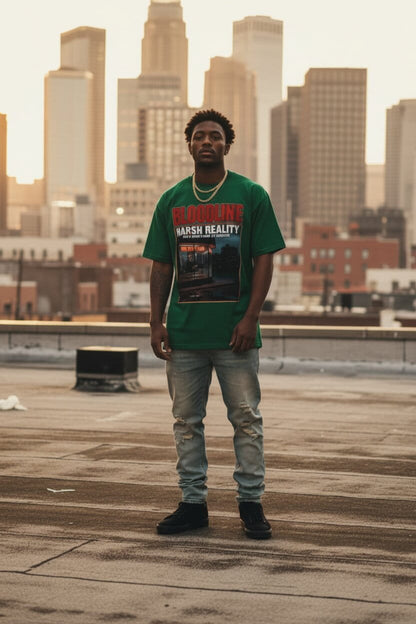 Person wearing a green t-shirt with text and graphics, standing on a rooftop with city skyline in the background.