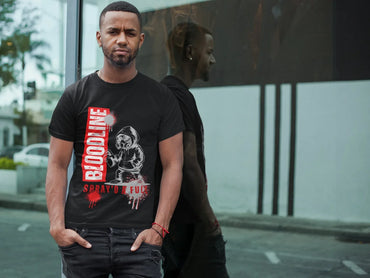 Man wearing a black t-shirt with graphic design and text on a city street.