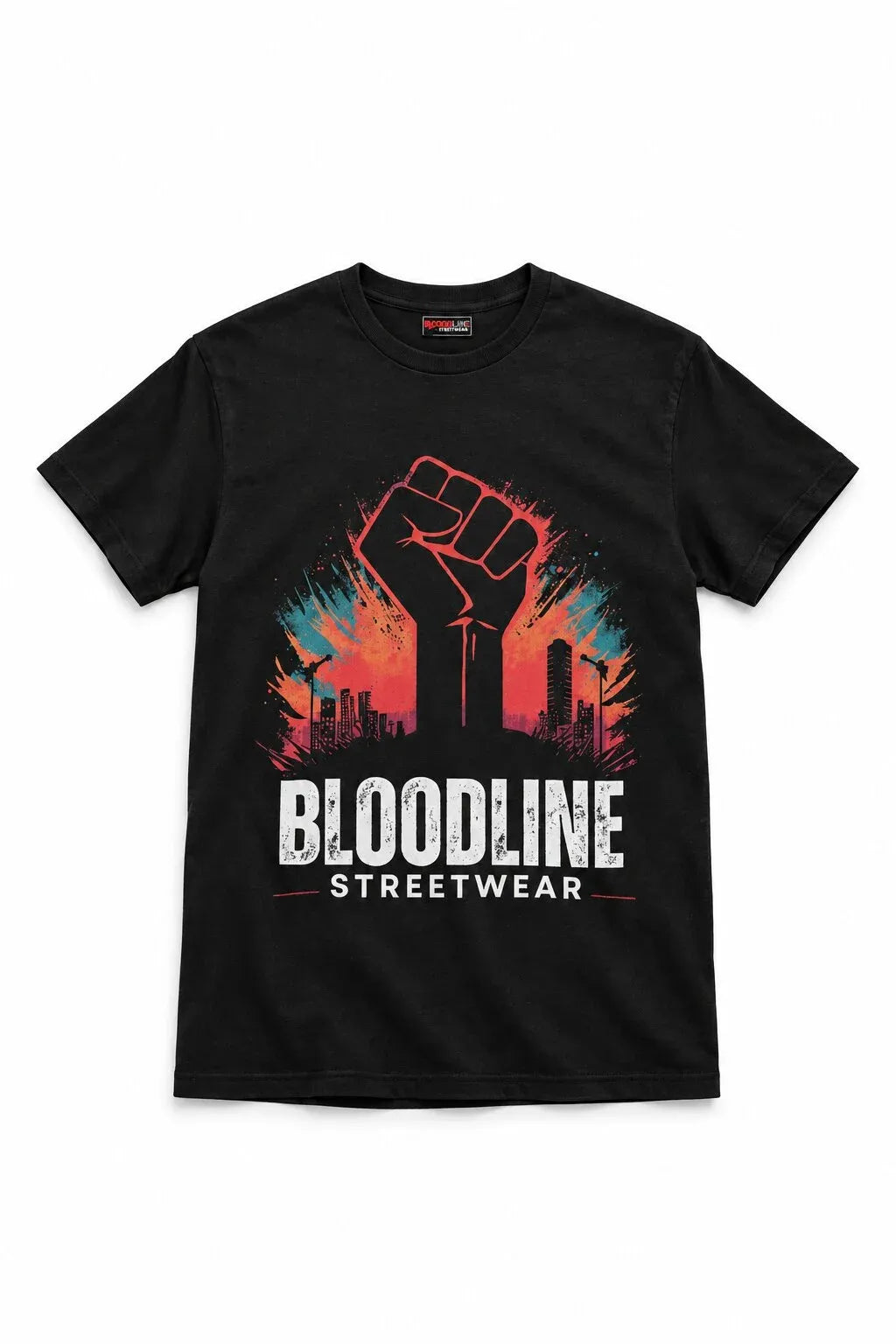 A black short-sleeve crewneck t-shirt featuring a graphic print of a raised fist in front of a city skyline with a red, orange, and blue gradient, and the text 'BLOODLINE STREETWEAR' printed below in white.
