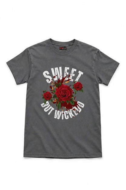 A dark gray crewneck t-shirt featuring a graphic print of red roses and the text 'SWEET BUT WICKED' in white arched lettering, displayed against a plain white background.