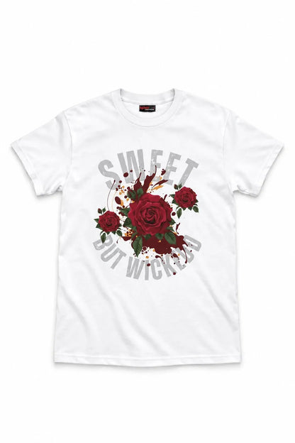 A white short-sleeve crewneck t-shirt featuring a graphic print of red roses with green leaves and a gray circular text design that reads 'SWEET BUT WITCHY'.
