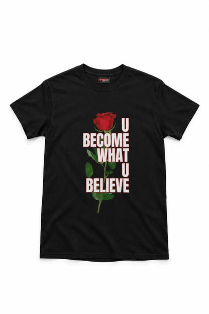 A black short-sleeve crewneck t-shirt featuring a graphic print of a red rose and the text 'U BECOME WHAT U BELIEVE' in white and red, displayed on a clean white background.